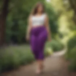 Elegant plus size model showcasing stylish purple capris in a vibrant outdoor setting